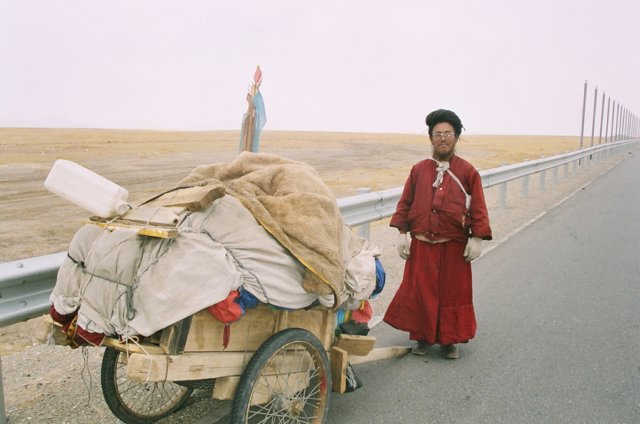 Another pilgrim. Going ahead with his cart then doubling back to prostrate, he does 3x the distance.